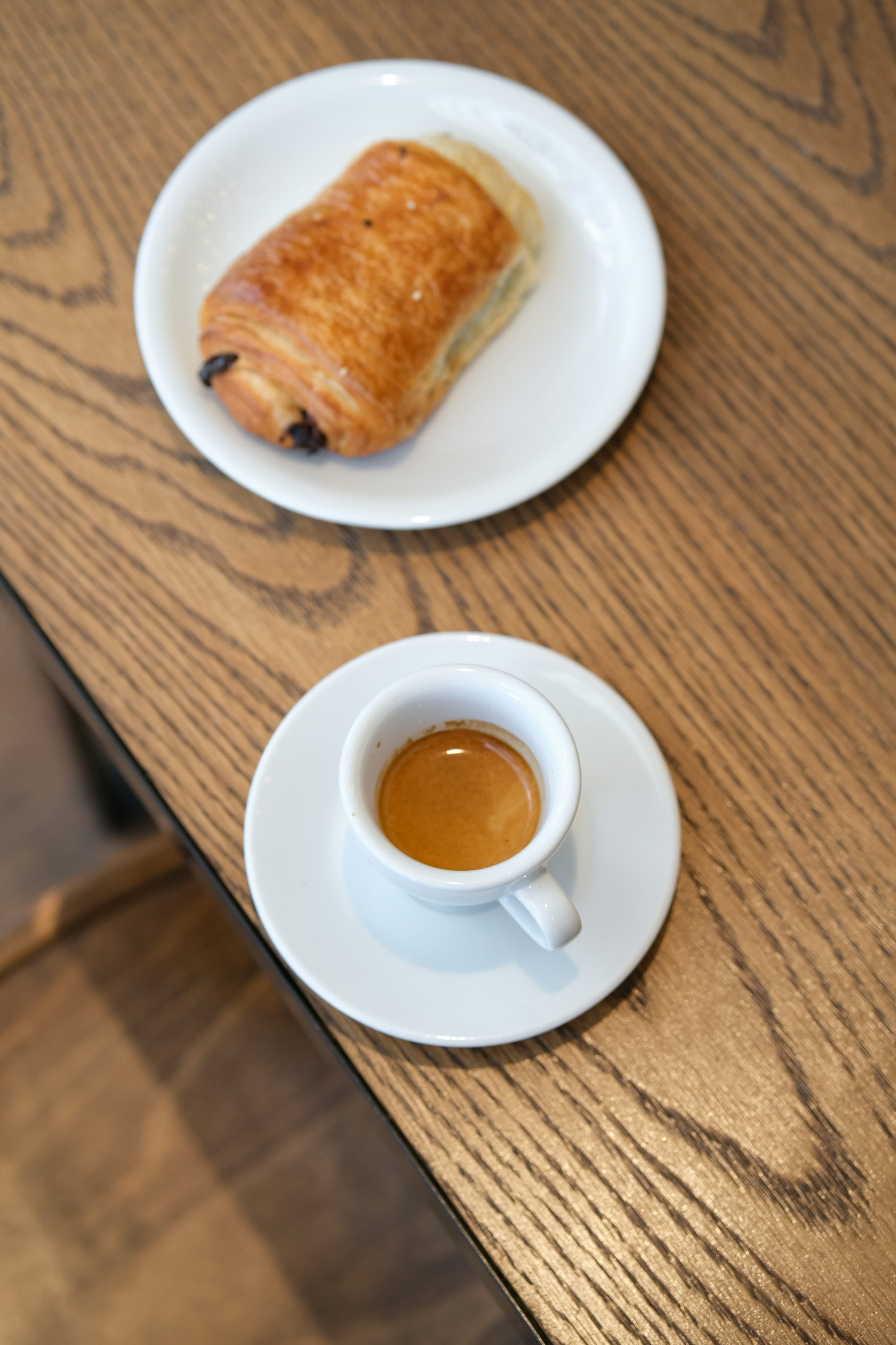 Espresso and pastry on a wooden table